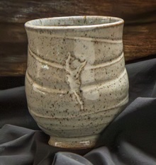 Cream stoneware mug with carved tree motif